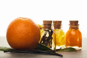 bottles or essential oils with orange and vanilla