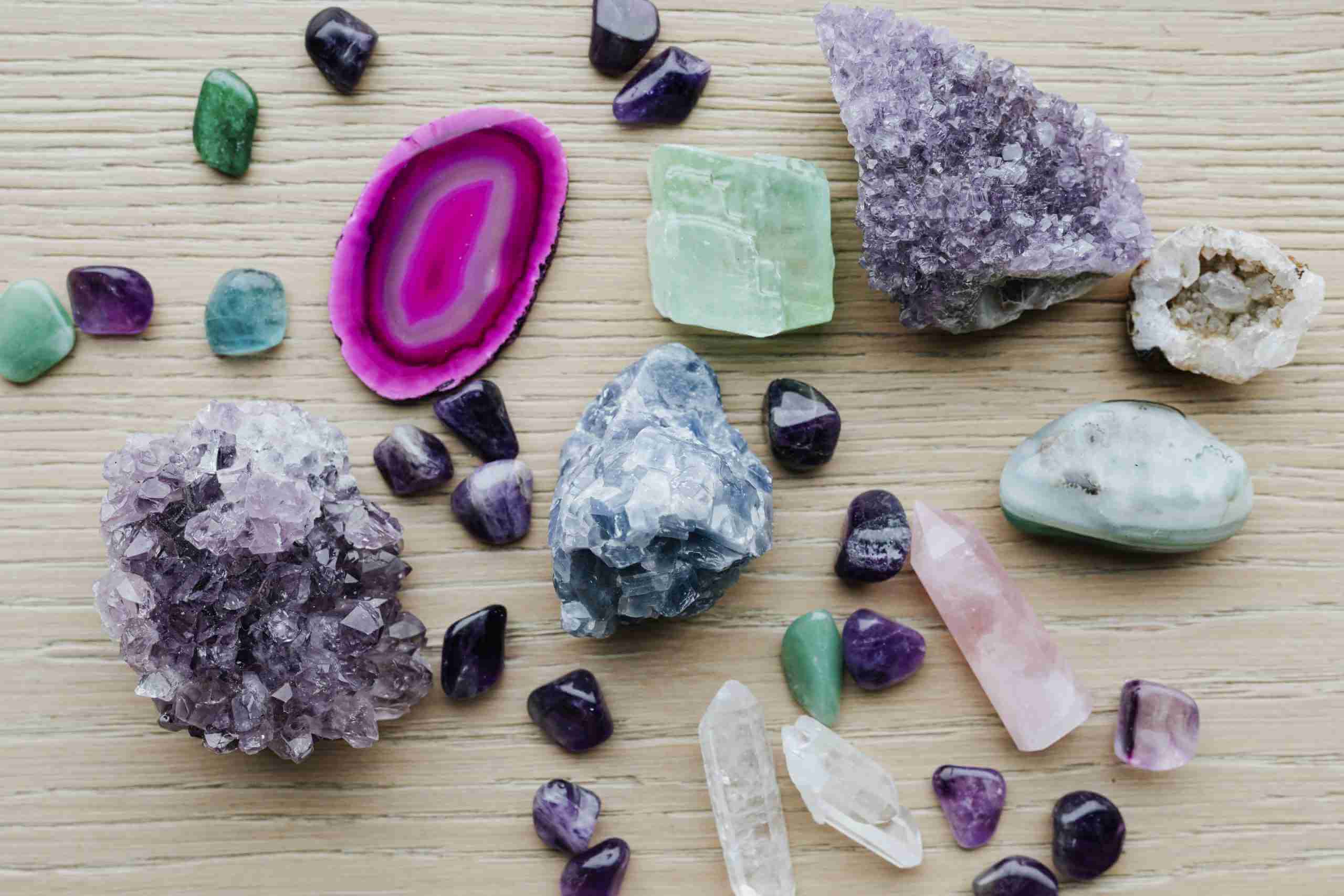 chakra river of gem stones on driftwood